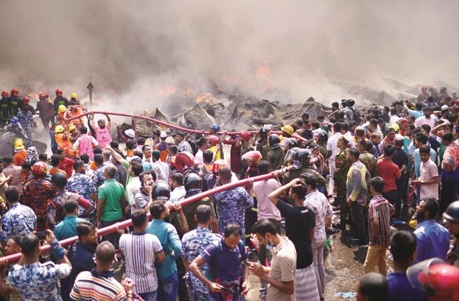 Chaos at the accident site in Banga Bazar. (AP/PTI)